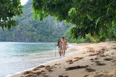 Nude twins masturbate dick on beach